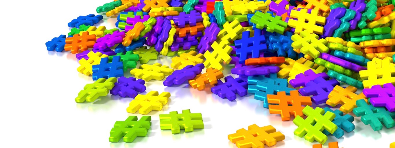 Pile of differently colored hashtag symbols on white social media concept 3D illustration