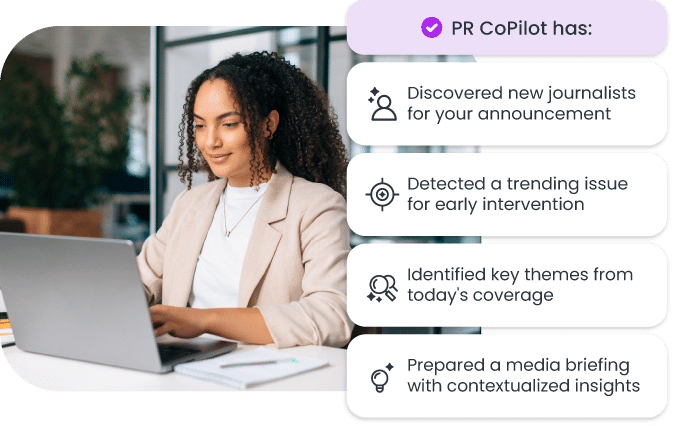 Woman working on laptop with PR CoPilot features listed, including journalist discovery, trend detection, and media insights.